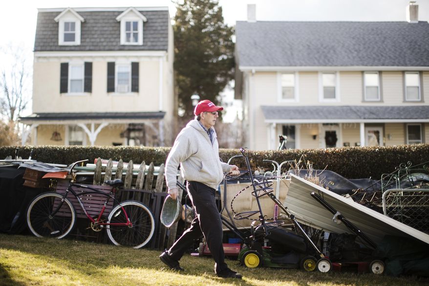 ADVANCE FOR USE TUESDAY, JAN. 17, 2017 AND THEREAFTER-John Buckley, a Republican who relies on disability benefits and voted for Donald Trump, moves scrap metal at his home in Malvern, Pa., 25 miles west of Philadelphia, Wednesday, Jan. 4, 2017. Chester is the richest county in Pennsylvania; it's majority Republican but Democratic presidential candidate Hillary Clinton won there easily. (AP Photo/Matt Rourke)