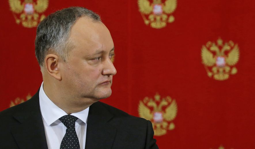 Moldovan President Igor Dodon attends a joint news conference with Russian President Vladimir Putin in the Kremlin in Moscow, Russia, Tuesday, Jan. 17, 2017. Moldova&#39;s new president, who is visiting Russia on his first trip abroad, is voicing hope for rebuilding &quot;strategic&quot; ties with Moscow. (Sergei Ilnitsky/Pool Photo via AP)