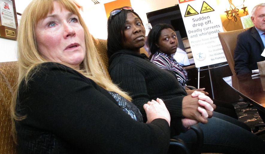 FILE- In this Oct. 25, 2016 photo Sandra Smith, left, Tasha Hart, center, and Domonique McNeil, right, appear at a news conference in Egg Harbor Township N.J., regarding the drowning deaths of relatives at a beach in North Wildwood N.J. Lawyers for Smith's family are trying to get a judge to order that a section of beach be permanently closed to the public because the sand is prone to giving way under the feet of beach goers, plunging them into water over their heads. The town asserts that closing the beach would ruin things for others who still want to go there, and that the unstable sand condition is part of nature and not something the town is obligated to fix. (AP Photo/Wayne Parry, File)