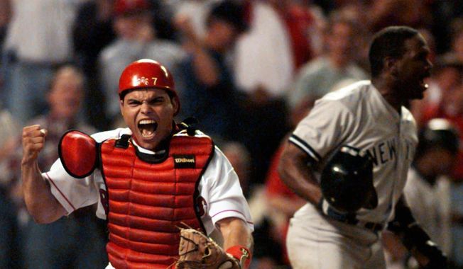 FILE - In this Oct. 4, 1996, file photo, Texas Rangers catcher Ivan Rodriguez reacts after tagging out New York Yankees&#x27; Tim Raines, right, as he tried to score in the fourth inning of Game 3 of the American League Divisional playoffs, in Arlington, Texas. Tim Raines and Jeff Bagwell are likely to be voted into baseball&#x27;s Hall of Fame on Wednesday, Jan. 18, 2017, when Trevor Hoffman and Ivan Rodriguez also could gain the honor. (AP Photo/Eric Gay, File)