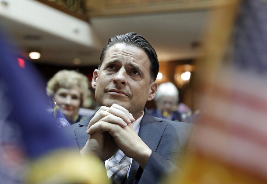 House Minority Leader Scott Pelath, D-Michigan City, listens as Indiana Gov. Eric Holcomb delivers his State of the State address to a joint session of the legislature at the Statehouse, Tuesday, Jan. 17, 2017, in Indianapolis. (AP Photo/Darron Cummings)