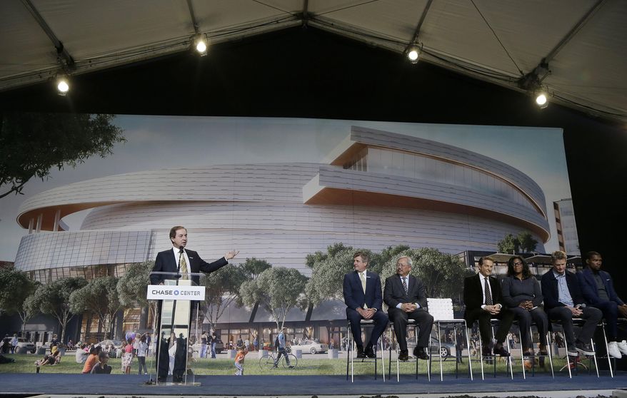 Golden State Warriors owner & CEO Joe Lacob, left, speaks during a ground breaking ceremony for the Chase Center in San Francisco, Tuesday, Jan. 17, 2017. (AP Photo/Jeff Chiu)