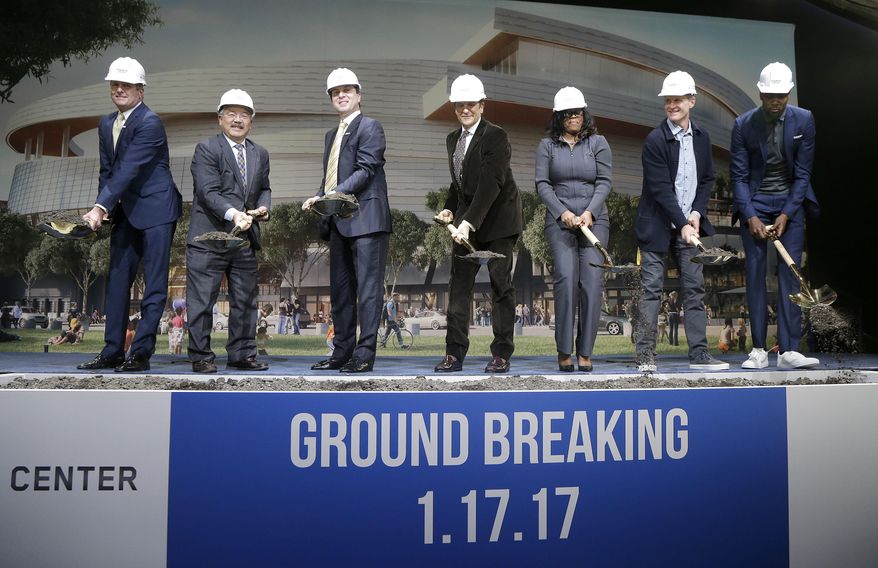 Golden State Warriors president & COO Rick Welts, from left, poses for photos with San Francisco Mayor Ed Lee, owner & CEO Joe Lacob, co-owner Peter Guber, Chase consumer banking CEO Thasunda Duckett, head coach Steve Kerr and forward Kevin Durant during a ground breaking ceremony for the Chase Center in San Francisco, Tuesday, Jan. 17, 2017. (AP Photo/Jeff Chiu)