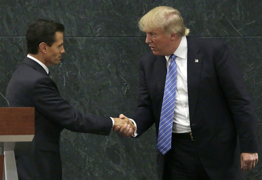 FILE - In this Aug. 31, 2016 file photo, Mexico&#x27;s President Enrique Pena Nieto, left, and Republican presidential nominee Donald Trump shake hands after a joint statement at Los Pinos, the presidential official residence, in Mexico City. Before his swearing-in, Trump has already hurt Mexico&#x27;s economy by pressuring automakers to shift factories out of Mexico and amid an uncertain economic outlook, the peso has plunged to all-time lows against the U.S. dollar. (AP Photo/Marco Ugarte, File)