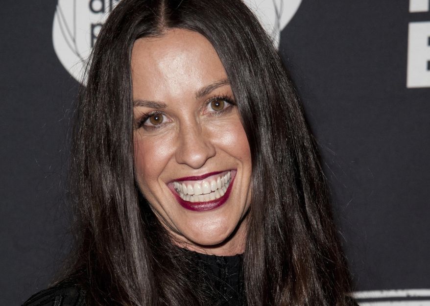 FILE - This June 20, 2014 file photo Alanis Morissette arrives at the 4th Annual Production Of The 24 Hour Plays After-Party in Santa Monica, Calif. Federal prosecutors say a business manager who embezzled more than $6.5 million from Morissette and other entertainment and sports figures has agreed to plead guilty. Jonathan Todd Schwartz agreed Wednesday, Jan. 18, 2017 to plead guilty in Los Angeles federal court to two felonies that carry a maximum of 23 years in federal prison. (Photo by Richard Shotwell/Invision/AP,File)