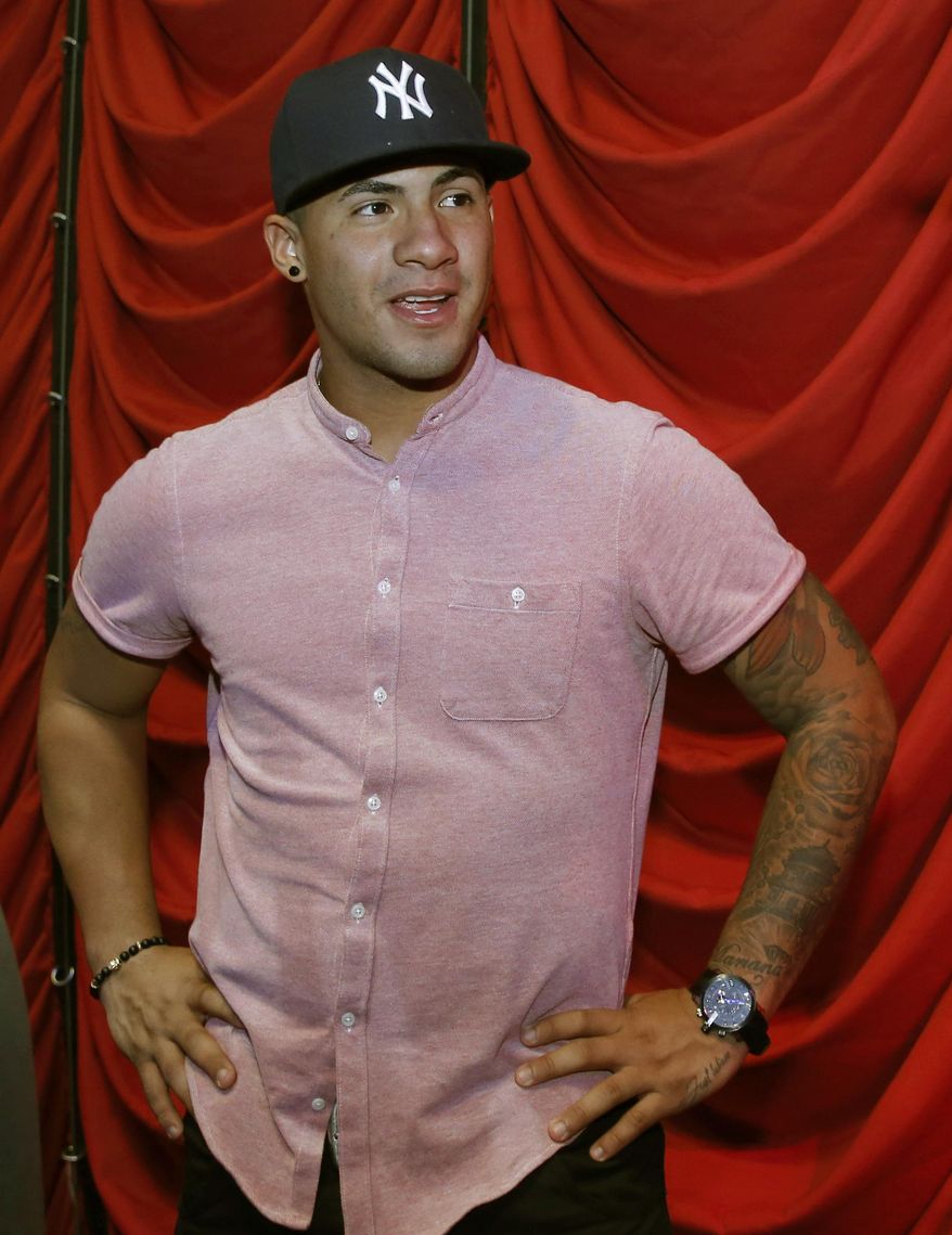 New York Yankees shortstop prospect Gleyber Torres pauses backstage before an appearance at the Hard Rock Cafe on Tuesday, Jan. 17, 2017, in New York. (AP Photo/Kathy Willens)