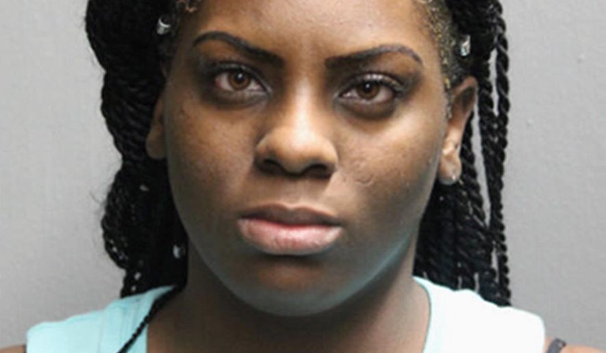 This booking photo provided by the Chicago Police Department shows Larrinita Starks, who has been charged with child endangerment after her 5-year-old daughter accidentally shot and wounded herself in the abdomen with a handgun that she found in her Stark's purse Tuesday night, Jan. 17, 2017. (Chicago Police department via AP)