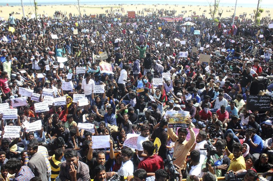 Protestors gather at Marina beach demanding a ban be lifted on the traditional sport of bull-taming, or Jallikattu, in Chennai, India, Wednesday, Jan. 18, 2017. The sport of jallikattu, held during the four-day &amp;quot;Pongal&amp;quot; marking the winter harvest, involves releasing a bull into a crowd of people who attempt to grab it and ride it. It is popular in Tamil Nadu state but was banned by India&#39;s top court in 2014 after animal rights groups argued it was cruel to the animals. (AP Photo)