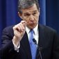 FILE- In this Dec. 15, 2016 file photo. North Carolina&#x27;s Governor Roy Cooper holds a press conference in Raleigh, N.C. As North Carolina&#x27;s political split widens, state business is increasingly being refereed with a judge&#x27;s gavel. Drawn-out legal fights that seem to have become a routine part of lawmaking are expensive for the litigants and often leave public policy in a protracted state of limbo. (Chris Seward/The News &amp;amp; Observer via AP, File)