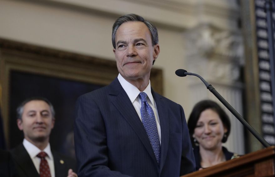 FILE - In this Jan. 10, 2017, file photo, Texas Speaker of the House Joe Straus, R-San Antonio, stands before the opening of the 85th Texas Legislative session in the House chambers at the Texas State Capitol after he was re-elected for a fifth consecutive term in Austin, Texas. Straus has branded as bad for business a Texas proposal barring transgender people from using public restrooms of their choice that's been championed by his state's leading conservatives despite echoing a law that caused upheaval in North Carolina. (AP Photo/Eric Gay, File)