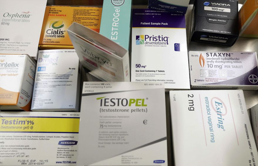 FILE - This Tuesday, Nov. 29, 2016, file photo shows a display of prescription medicines for impotence and sexual problems at a doctor's office in San Diego. For many older couples, fun in the bedroom requires prescription help, but prices of the most popular brand-name sexual dysfunction drugs have tripled over the past seven years. (AP Photo/Gregory Bull, File)