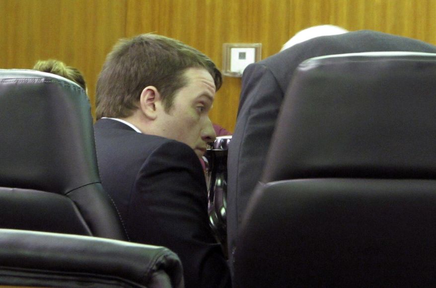 Suspended South Carolina Rep. Chris Corley, left, talks to his lawyer, John Delgado, right, at the Aiken County courthouse in Aiken, S.C., on Wednesday, Jan. 18, 2016. A judge set a $50,000 bond for Corley on a more serious charge of domestic violence. Corley was originally charged with second-degree criminal domestic violence, but an Aiken County grand jury indicted the 36-year-old Republican earlier this month on the more serious charge of criminal domestic violence of a high and aggravated nature. (AP Photo/Jeffrey Collins)