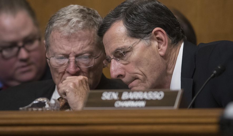 Senate Environment and Public Works Committee Chairman Sen. John Barrasso, R-Wyo., right, confers with Sen. James Inhofe, R-Okla. on Capitol Hill in Washington, Wednesday, Jan. 18, 2017, during the committee&#39;s confirmation hearing for Environmental Protection Agency Administrator-designate, Oklahoma Attorney General Scott Pruitt. (AP Photo/J. Scott Applewhite) ** FILE **