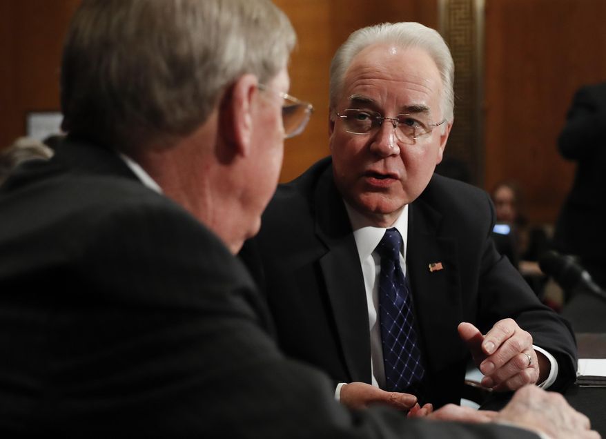 Health and Human Services Secretary-designate, Rep. Tom Price, R-Ga., right, talks with Sen. Johnny Isakson, R-Ga. on Capitol Hill in Washington, Wednesday, Jan. 18, 2017, prior to the start of Price's confirmation hearing before the Senate Health, Education, Labor and Pensions Committee. (AP Photo/Carolyn Kaster)