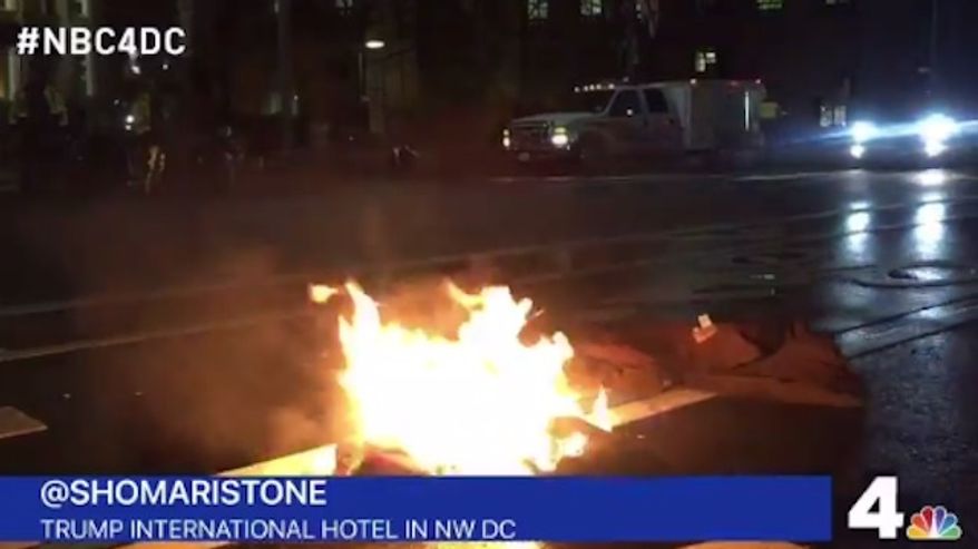 A California man was hospitalized Tuesday night after he tried to light himself on fire in front of the Trump International Hotel in Washington, D.C., as an "act of protest" against the president-elect. (NBC 4/@shomaristone)