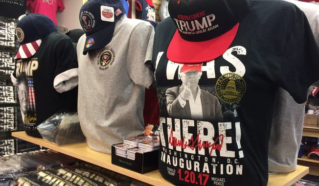 Donald Trump&#x27;s surprise win over Hillary Clinton in November&#x27;s election prompted the owner of White House gifts in the District to make a mad scramble to replace his Clinton T-shirts with Trump shirts and baseball caps. (Photographs by Julia Brouillette/The Washington Times)