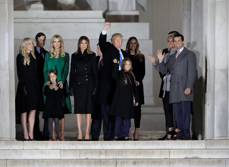 President-elect Donald Trump, accompanied by his family, waved to the crowd at the conclusion of the "Make America Great Again! Welcome Celebration" at the Lincoln Memorial on the eve of his inauguration. (Associated Press)