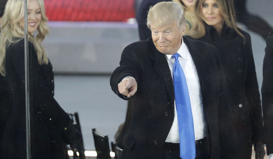 President-elect Donald Trump and his wife Melania Trump, right, arrive at a pre-Inaugural "Make America Great Again! Welcome Celebration" at the Lincoln Memorial in Washington, Thursday, Jan. 19, 2017. At left is daughter Tiffany Trump. (AP Photo/David J. Phillip)