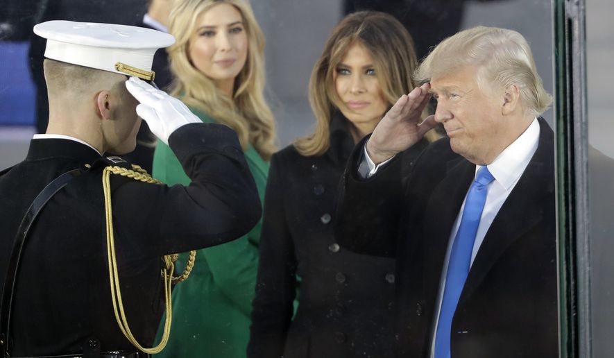 President-elect Donald Trump salutes as he arrives with his wife Melania Trump at a pre-Inaugural &quot;Make America Great Again! Welcome Celebration&quot; at the Lincoln Memorial in Washington, Thursday, Jan. 19, 2017. Watching is daughter Ivanka, second from left. (AP Photo/David J. Phillip)