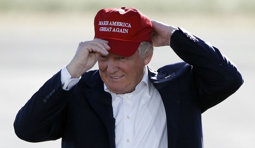 Republican presidential candidate Donald Trump wears his &quot;Make America Great Again&quot; hat at a rally in Sacramento, Calif., on June 1, 2016. (Associated Press) **FILE**