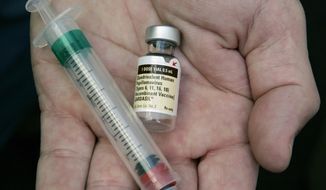 In this Aug. 28, 2006, file photo, a doctor holds a vial of the human papillomavirus (HPV) vaccine Gardasil in his Chicago office. A national estimate suggests that nearly half of U.S. men have mostly silent infections caused by the sexually-transmitted human papillomavirus, and that 1 in 4 has strains linked with several cancers. The study was released Thursday, Jan. 19, 2017. (AP Photo/Charles Rex Arbogast, File)