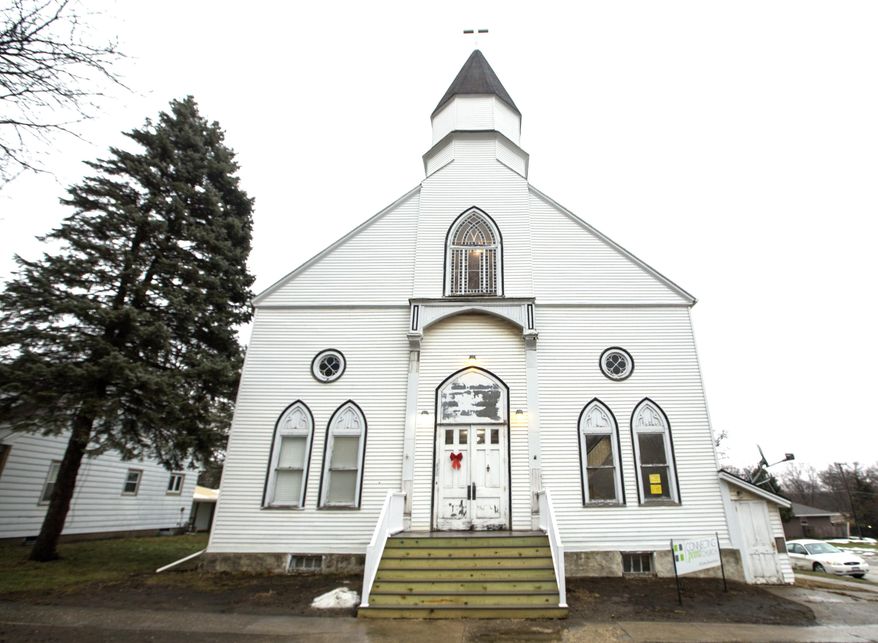 ADVANCE FOR USE SATURDAY, SATURDAY JAN. 21, 2017 AND THEREAFTER - This Jan. 10, 2017 photo shows the new home of the Connecting Point Church, in Pecatonica, Ill. Connecting Point moved from Freeport to Pecatonica into this historical church built in 1875. Knoup and his congregation have been rehabbing the old church. (Arturo Fernandez/The Journal-Standard, via AP)