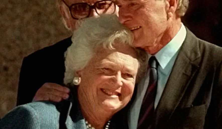 FILE - In this Nov. 6, 1997, file photo, former President George H.W. Bush hugs his wife, Barbara, after speaking at the dedication of the George Bush Presidential Library in College Station, Texas. The Bushes were married Jan. 6, 1945, and have had the longest marriage of any presidential couple in American history. (AP Photo/Pat Sullivan, File)