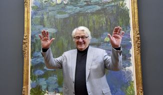 SAP founder Hasso Plattner stands in front of the painting &amp;quot;Water lily&amp;quot; by Claude Monet in the newly opened Barberini Museum in Potsdam, eastern Germany, Thursday, Jan. 19, 2017. (Bernd Settnik/dpa via AP)