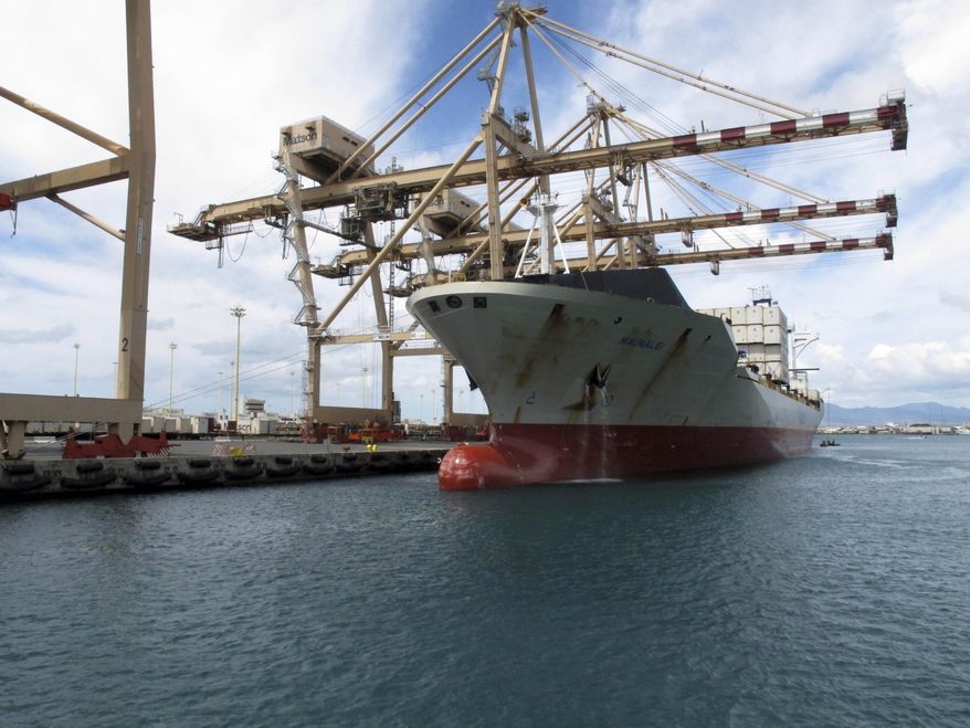In this Sept. 16, 2013 file photo, a Maston ship sits in Honolulu Harbor near the site of a molasses spill. The U.S. Environmental Protection Agency has reached a settlement with the shipping company responsible for the 1,400-ton molasses spill in Honolulu Harbor in 2013. The federal agency announced in a statement Thursday, Jan. 19, 2017 that Matson Terminals Inc. will pay a civil penalty of $725,000. The molasses leaked from a section of pipe that had been flagged by the state a year before the spill. (AP Photo/Oskar Garcia, File)