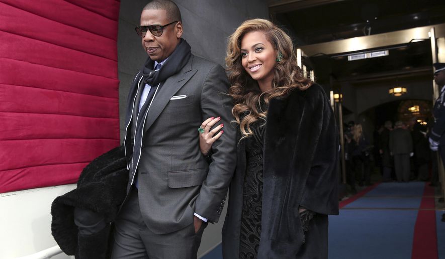 FILE - This Jan. 21, 2013 file photo shows recording artists Jay-Z and Beyonce arriving on the West Front of the Capitol in Washington for the Presidential Barack Obama&#x27;s ceremonial swearing-in ceremony during the 57th Presidential Inauguration. President Barack Obama embraced hip-hop more than any of his predecessors. He once referenced Jay Z&#x27;s lyrics, released his music playlist including several rappers from Chance the Rapper to Lil Wayne and was caught dancing to Drake&#x27;s &amp;quot;Hot Line Bling&amp;quot; at a White House event. (AP Photo/Win McNamee, Pool)