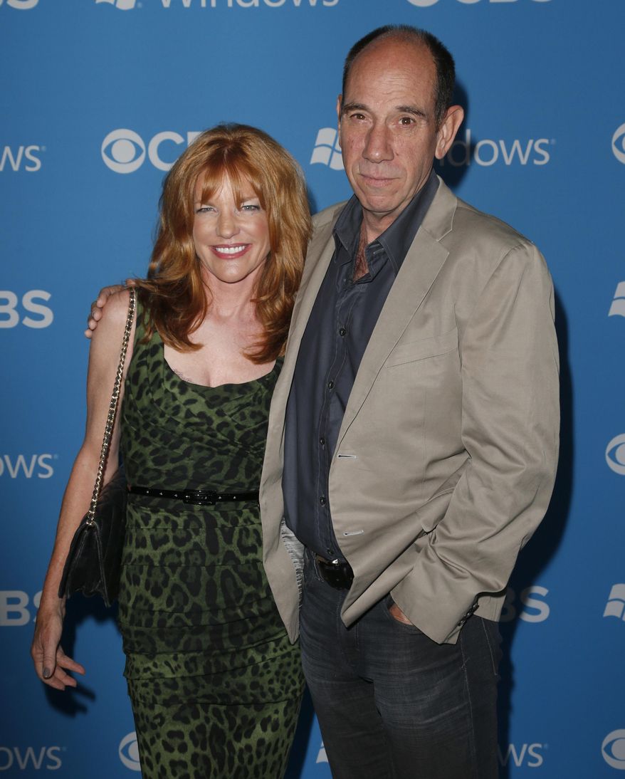 FILE - This Sept. 18, 2012 file photo shows Lori Weintraub, left, and actor Miguel Ferrer at the CBS 2012 Fall Premiere Party in West Hollywood, Calif. Ferrer, who brought stern authority to his featured role on CBS’ hit drama “NCIS: Los Angeles” and, before that, to “Crossing Jordan,” died, Thursday, Jan. 19, 2017, of cancer at his Los Angeles home. He was 61. (Photo by Todd Williamson/Invision/AP, File)