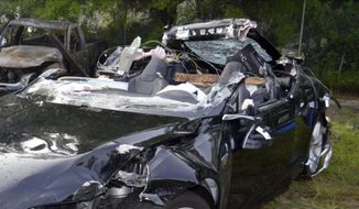 In this photo provided by the National Transportation Safety Board via the Florida Highway Patrol shows a Tesla Model S that was being driven by Joshua Brown, who was killed when the Tesla sedan crashed while in self-driving mode on May 7, 2016. A source tells The Associated Press that U.S. safety regulators are ending an investigation into a fatal crash involving electric car maker Tesla Motors&#39; Autopilot system without a recall. (NTSB via Florida Highway Patrol via AP, File)