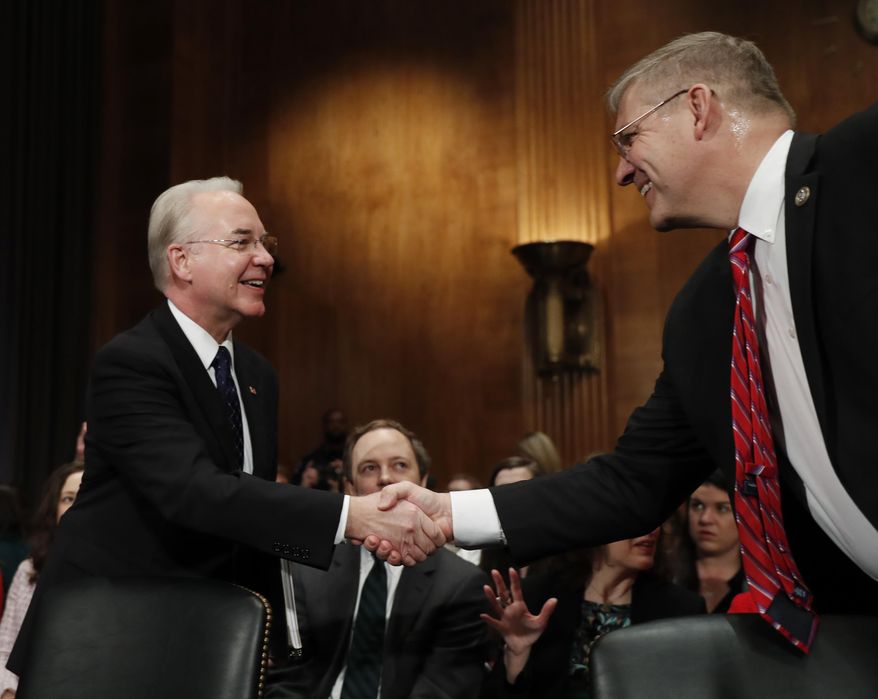 Health and Human Services Secretary-designate, Rep. Tom Price, R-Ga., left, is greeted on Capitol Hill in Washington, Wednesday, Jan. 18, 2017, by Rep. Barry Loudermilk, R-Ga., prior to testifying at this confirmation hearing before the Senate Health, Education, Labor and Pensions Committee. (AP Photo/Carolyn Kaster)