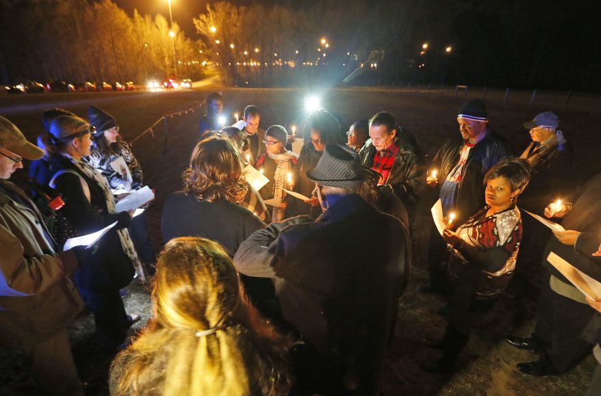 Death penalty opponents hold a candlelight vigil outside the Greensville Correctional Center in Jarratt, Va., Wednesday, Jan. 18, 2017. Ricky Gray was sentenced to death in 2006 for the murders of 9-year-old Stella Harvey and 4-year-old sister Ruby, and to life in prison for the slayings of their parents, Bryan and Kathryn Harvey.(AP Photo/Steve Helber)