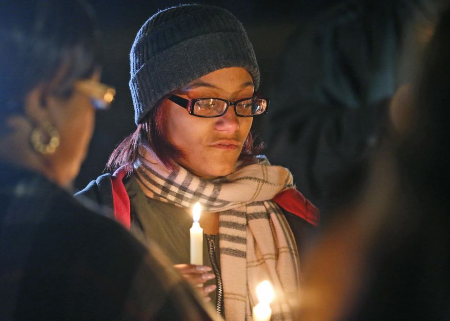 Death penalty opponents hold a candlelight vigil outside the Greensville Correctional Center in Jarratt, Va., Wednesday, Jan. 18, 2017. Ricky Gray was sentenced to death in 2006 for the murders of 9-year-old Stella Harvey and 4-year-old sister Ruby, and to life in prison for the slayings of their parents, Bryan and Kathryn Harvey.(AP Photo/Steve Helber)
