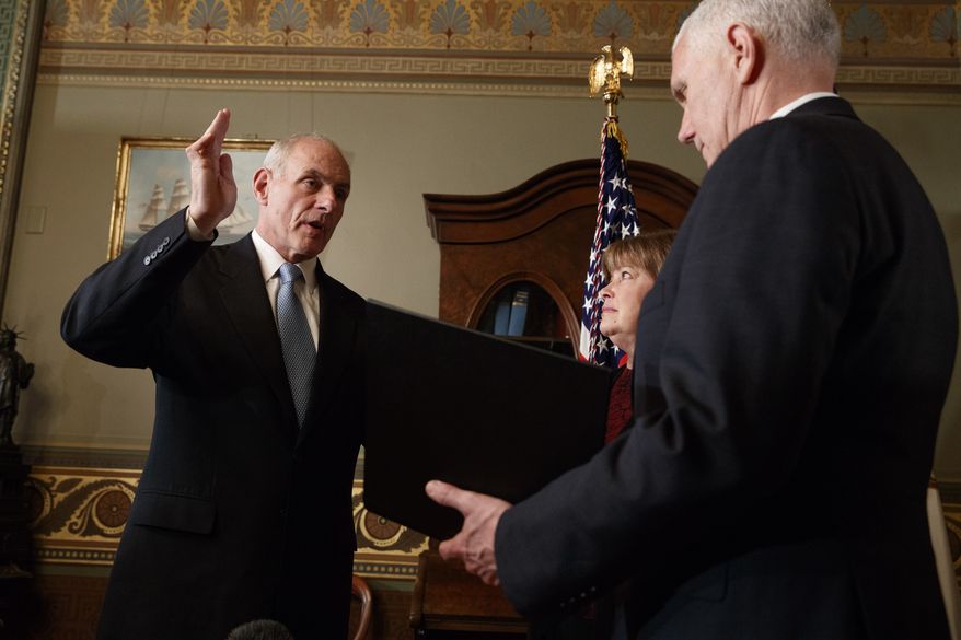 Vice President Mike Pence administers the oath of office to Homeland Security Secretary John Kelly in the Vice Presidential Ceremonial Office in the Eisenhower Executive Office building on the White House grounds in Washington, Friday, Jan. 20, 2017. (AP Photo/Evan Vucci)