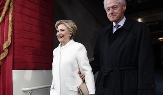 Former President Bill Clinton and his wife Hillary Clinton arrive on Capitol Hill in Washington, Friday, Jan. 20, 2017, for the presidential inauguration of Donald Trump. (Saul Loeb via AP, Pool)