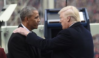 President Barack Obama shake hands with President-elect Donald Trump during the Presidential Inauguration at the US Capitol in Washington, DC, on January 20, 2017. / AFP PHOTO / POOL / SAUL LOEB