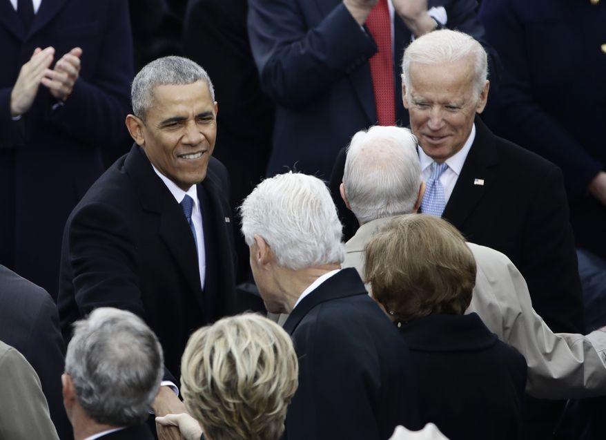 President Barack Obama greets Former President Bill Clinton before the 58th Presidential Inauguration at the U.S. Capitol in Washington, Friday, Jan. 20, 2017. Right is Vice President Joe Biden. (AP Photo/Matt Rourke)