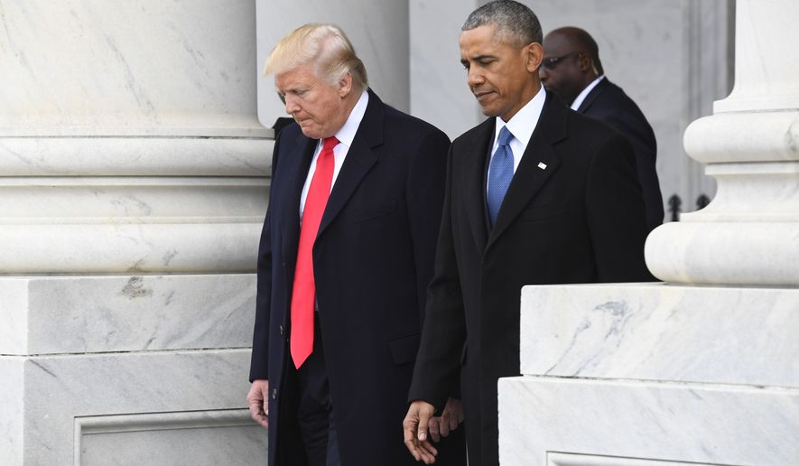 President Donald Trump walks with former President Barack Obama on Capitol Hill in Washington, Friday, Jan. 20, 2017, prior to Obama&#x27;s departure from the 2017 Presidential Inauguration. (Jack Gruber/Pool Photo via AP)