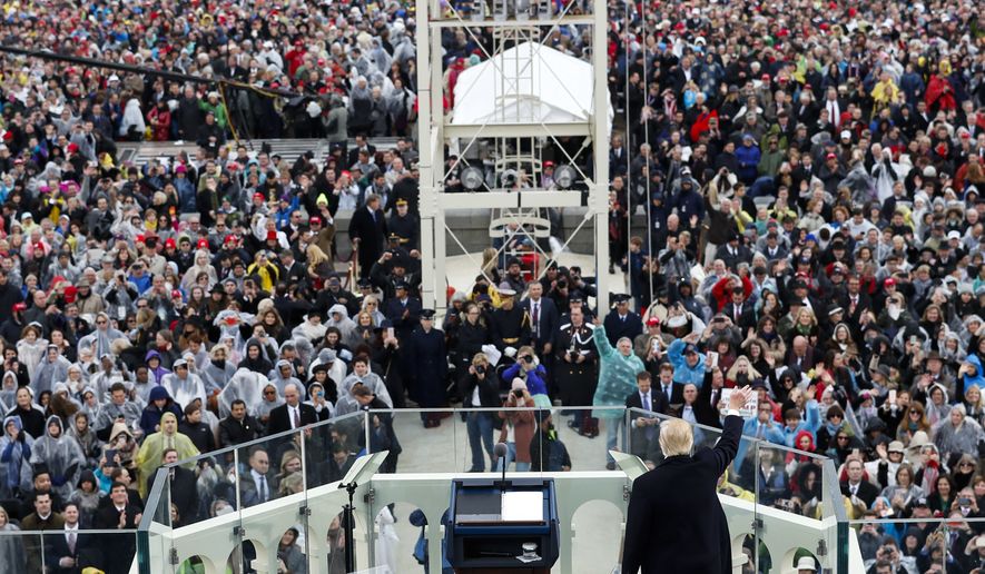 President Donald Trump waves to the crowd after speaking during the 58th Presidential Inauguration at the U.S. Capitol in Washington, Friday, Jan. 20, 2017. (AP Photo/Carolyn Kaster)