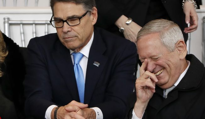 Defense Secretary-designate James Mattis, right, laughs as he waits with Former Gov. Rick Perry, R-Tex., for the 58th Presidential Inauguration parade for President Donald Trump in Washington. Friday, Jan. 20, 2017 (AP Photo/Pablo Martinez Monsivais)