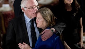 Sen. Bernie Sanders, I-Vt., hugs his wife Jane O&#39;Meara Sanders, during the inaugural luncheon in honor of President Donald Trump at the Statuary Hall in the Capitol, Friday, Jan. 20, 2017, in Washington. (AP Photo/Manuel Balce Ceneta)