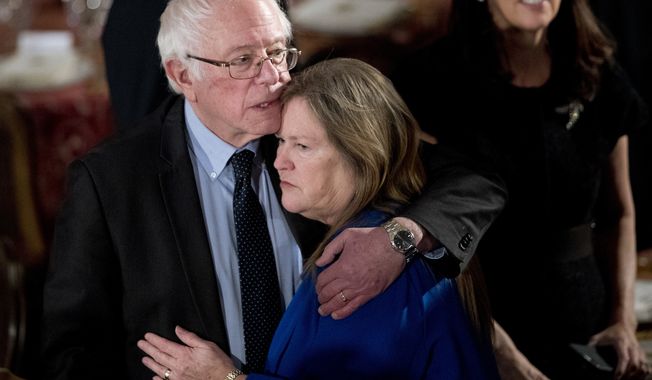 Sen. Bernie Sanders, I-Vt., hugs his wife Jane O&#x27;Meara Sanders, during the inaugural luncheon in honor of President Donald Trump at the Statuary Hall in the Capitol, Friday, Jan. 20, 2017, in Washington. (AP Photo/Manuel Balce Ceneta)