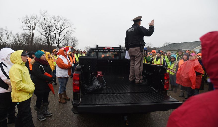 CORRECTS SPELLING OF LAST NAME TO LYON, NOT LYONS - Sheriff Timothy Parker gives instructions as people gather to search for Jace Lyon, 9, in a rural area just north of Hillsdale, Mich., Friday, Jan. 20, 2017. Lyon has been missing since Wednesday evening, Jan. 18. (J. Scott Park/Jackson Citizen Patriot via AP)