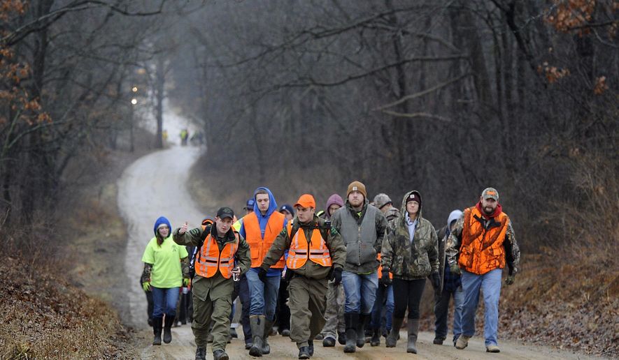 CORRECTS SPELLING OF LAST NAME TO LYON, NOT LYONS - Volunteers gather to search for Jace Lyon, 9, in a rural area just north of Hillsdale, Mich., Friday, Jan. 20, 2017. Lyon has been missing since Wednesday evening, Jan. 18. (J. Scott Park/Jackson Citizen Patriot via AP)