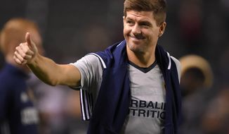 FILE - In this Feb. 9, 2016, file photo, Los Angeles Galaxy midfielder Steven Gerrard, gestures to fans after a soccer match against Club Tijuana, in Carson, Calif. Gerrard is returning to Liverpool, England, it was announced Friday, Jan. 20, 2017, to take up a position in the team&#x27;s youth academy, starting in February. (AP Photo/Mark J. Terrill, File)