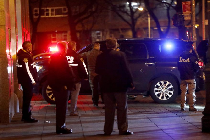 A vehicle carrying Mexican drug kingpin Joaquin "El Chapo" Guzman arrives at the Metropolitan Correctional Center in New York, Thursday, Jan. 19, 2017. The infamous drug kingpin who twice escaped from maximum-security prisons in Mexico was extradited at the request of the U.S. to face drug trafficking and other charges, and landed in New York late Thursday, a federal law enforcement official said. (AP Photo/Julio Cortez)