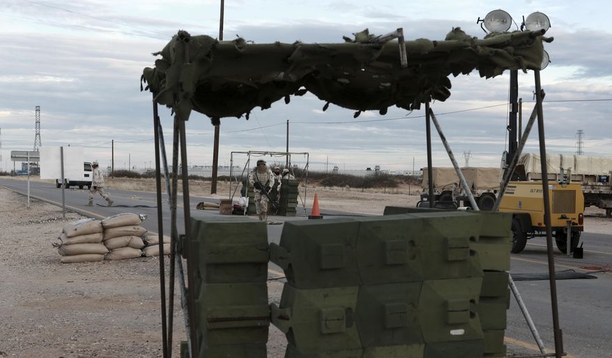 Soldiers guard the entrance to the prison where drug lord Joaquin "El Chapo" Guzman was held in Ciudad Juarez, Mexico, Thursday, Jan. 19, 2017. The infamous drug kingpin who twice escaped from maximum-security prisons in Mexico was extradited at the request of the U.S. to face drug trafficking and other charges, and landed in New York late Thursday, a federal law enforcement official said. (AP Photo/Christian Torres)