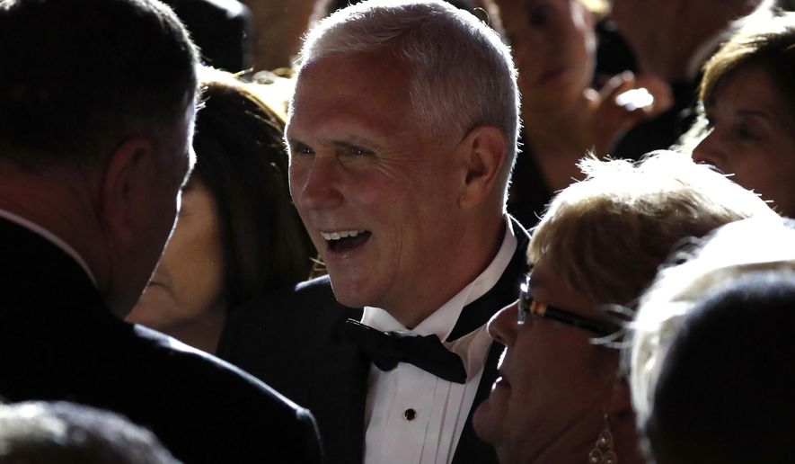 Vice president-elect Mike Pence, center, greets supporters at the Indiana Inaugural Ball, Thursday, Jan. 19, 2017 in Washington. (AP Photo/Alex Brandon)